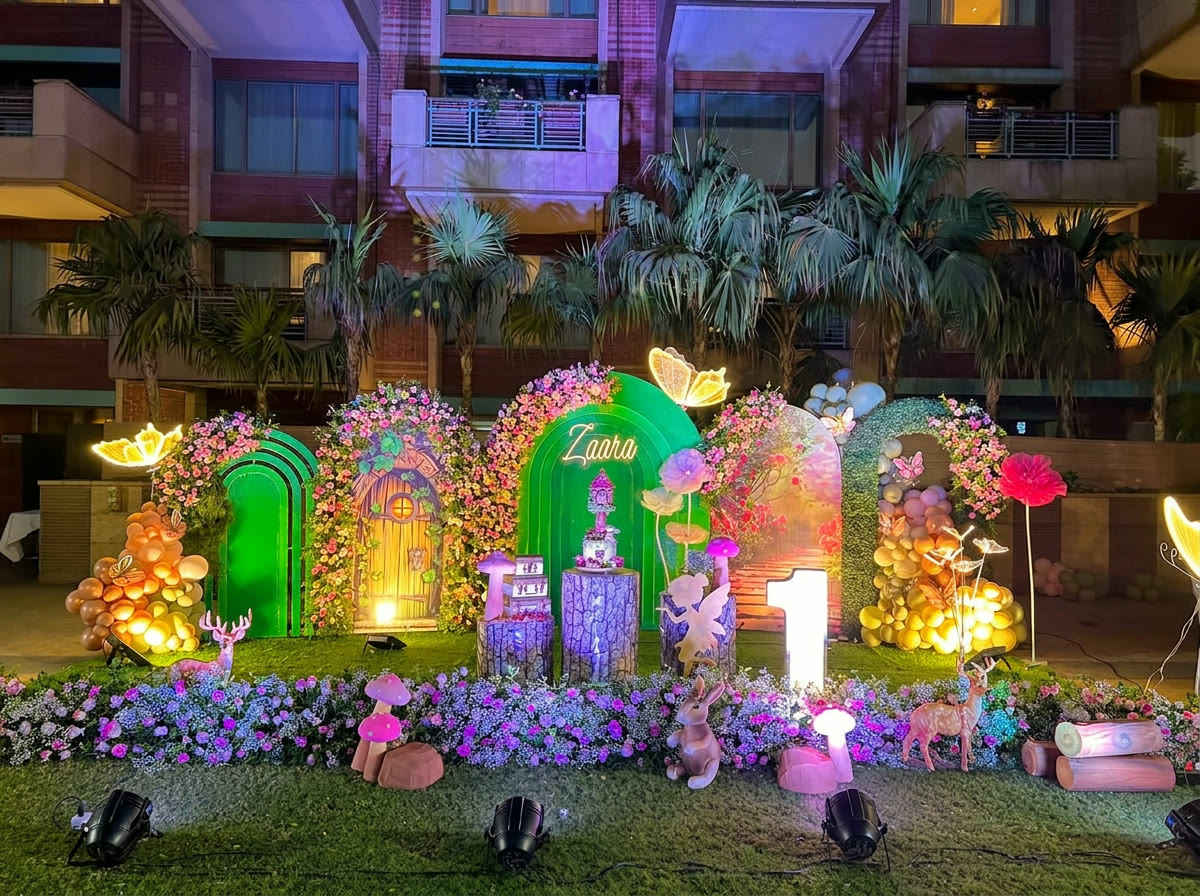 Fantasy themed birthday installation with glowing arches and florals